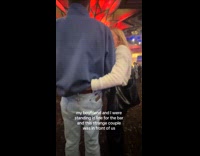 Girl smells hand touching guy