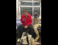 Guy sits with newspaper man 