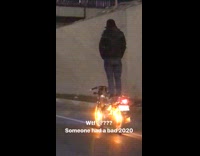 Man stand balance on motorcycle highway night