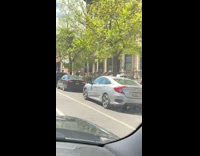 Car drives at sidewalk tired of traffic