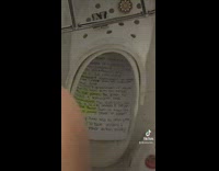 Guy cheating on test with paper in white croc shoe 