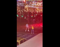 Man white jacket tiktok dance middle street