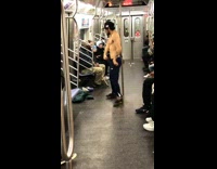 Shirtless guy dances and shifts feet on subway train