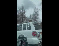 White car with long antennas and lights 