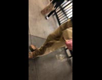 Black shirt guy wet pants subway station