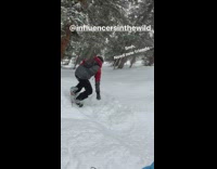 Man red jacket poses for picture