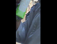 man in all white on boat drinking white wine in box