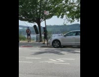 Guy black punching bag tree red gloves 