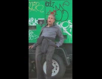 Guy fallen asleep leaning against electrical generator