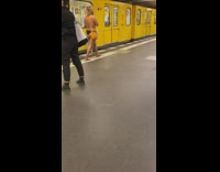 Naked man in black underwear yellow train
