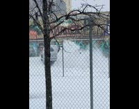 White SUV car driving around and drifting on the track in the snow 
