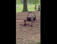 Guy reads book while laying on thin rope 