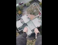 Guy on rooftop jumps and floats midair 