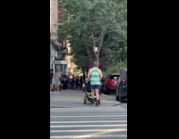 Man skating rollerblades while pushing stroller 