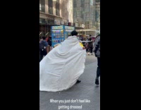 Collab WINY - Man wearing white fleece coat on street