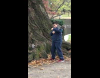 Squirrel sits on arm of boy 