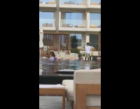 Woman blue bikini dip hotel pool photo shoot