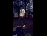 Little boy in the park does a backflip off a bench table and falls on face