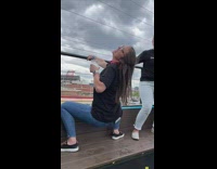 Dancing lady bends down and rips jeans 