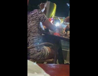 Woman zebra print dress selfie table pasta