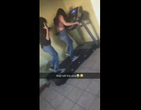 Two girls treadmill gradually gets faster girl in the back falls off and hits table