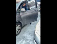 Man punching another man because of traffic 