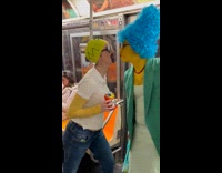 Collab Subway Creatures - Homer and Marge Simpson cosplayers kiss in subway