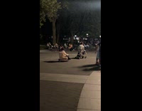 Skateboard with chair pulls friend at park