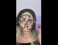 Woman uses makeup to paint two people on face