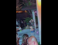 Woman in a shiny dress poses at the event floor Part 1