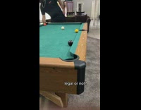 Guy uses leaf blower to push black cue ball into hole 