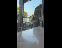 Man stripes sweater dance video outside store