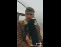 Brown jacket guy cat favorite positions rain 