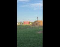 Two girls dance tiktok over haystack farm 