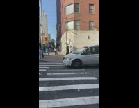 Guy in car wait stoplight play flute instrument