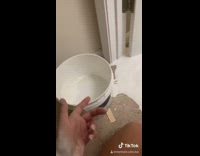 Girl spills paint on floor carpet