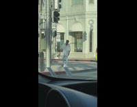Man white shirt cross street take off shades
