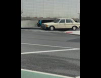 Semi truck drag parked car on the street