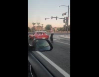 Collab IITW - Man pictures the red car on street