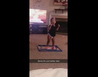 Baby girl step dances and sings out loud in living room