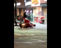 Two Santas ride mini red car sleigh to pizza and mcdonalds restaurant 