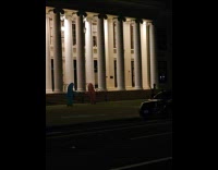 Two shark mascot films outside Alameda School