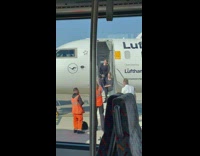 Two stewardess sits on airplane stairs pictorial