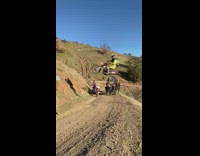 Dirt Bike Rider Jumps Through Gap as he Ascends