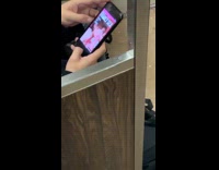 Guy looks up porn on his phone on subway train