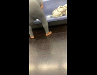 Grey bodysuit person reaches in pants subway 