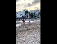 Woman in black bikini tiktok dance at the beach
