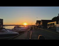 time lapse of sunset on beach dock