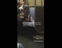 man in full uniform carrying rabbit on his lap