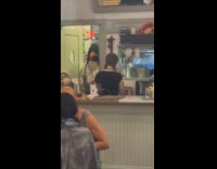 Collab WINY - Person aluminum suit penguin head at restaurant